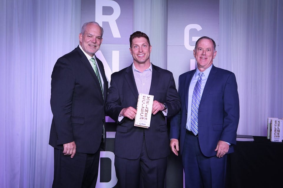 Joel receiving Business Excellence Award