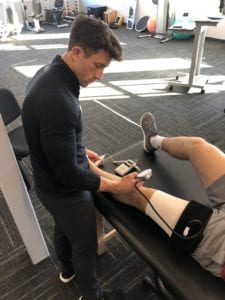 Landon Booker performing blood flow restriction