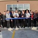Speaking before cutting ribbon at plattsmouth clinic